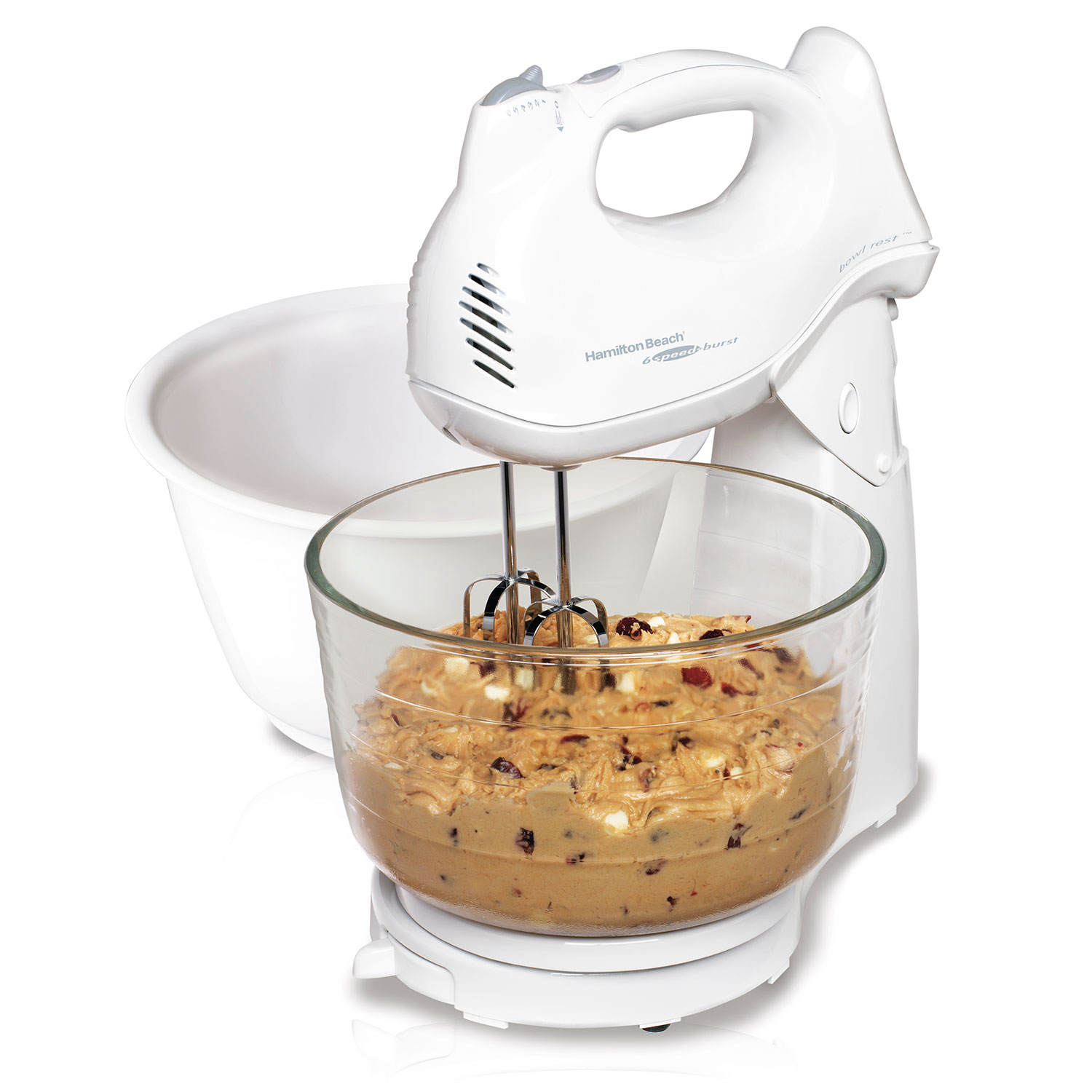 Hamilton Beach 64693 white six-speed hand/stand mixer docked above a clear glass bowl, with the nested plastic bowl visible behind it