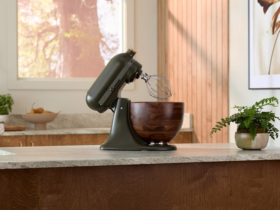 KitchenAid exact KSM180WSEG Evergreen mixer with walnut bowl.