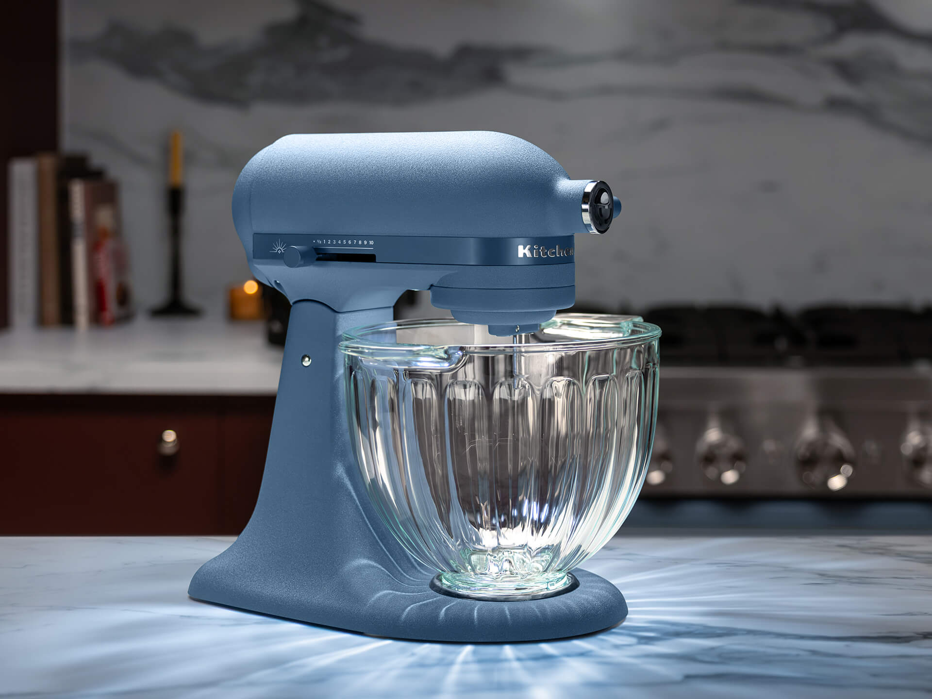KitchenAid 2026 Design Series Luminaire KSM50GSVXBP in Blue Peppercorn with its fluted glass bowl illuminated